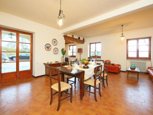 a kitchen with a table and chairs in a room at Holiday Home Montebello by Interhome in Monterchi