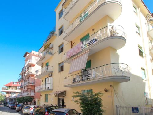 a tall building with balconies and cars parked on the street at Apartment Aurelia by Interhome in Rome