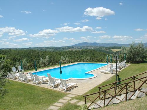 a swimming pool with lounge chairs and a view at Holiday Home Malagronda-1 by Interhome in Ravigliano