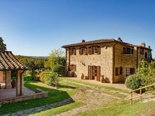 an old stone house with a garden in front of it at Holiday Home Malagronda-1 by Interhome in Ravigliano