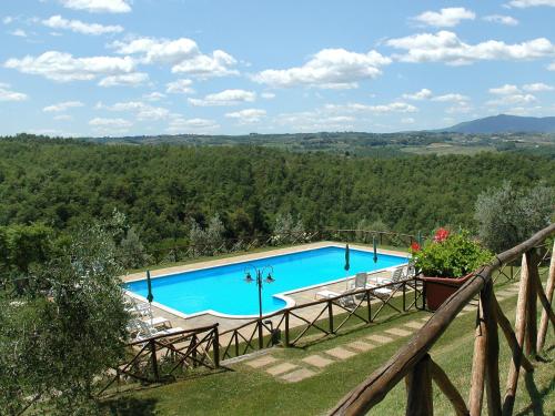a pool with a view of the hills at Holiday Home Malagronda-1 by Interhome in Ravigliano