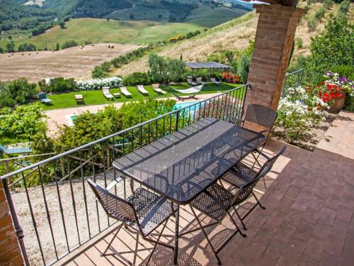 a table and chairs on a balcony with a view at Apartment Allerona-1 by Interhome in Allerona