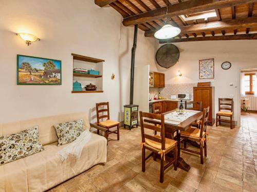 a living room with a couch and a table at Holiday Home Casa Graziani-5 by Interhome in Ravigliano