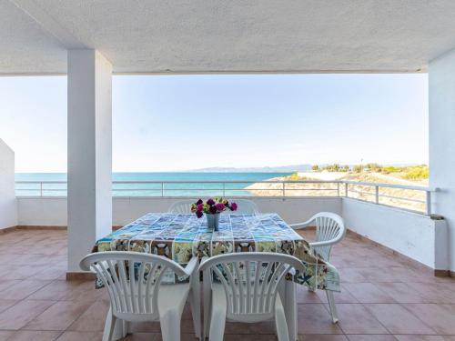 a table on the balcony with a view of the ocean at Apartment Rits-1 by Interhome in Salou