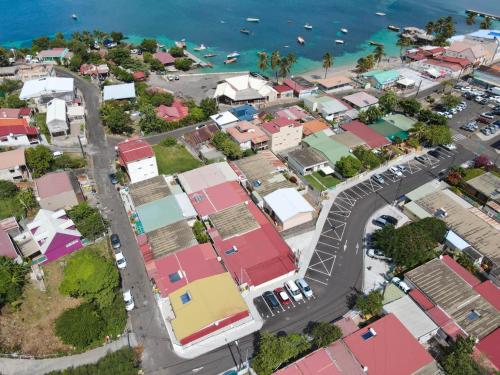 an overhead view of a city with colorful houses at Villa Perle Dor in Sainte-Anne