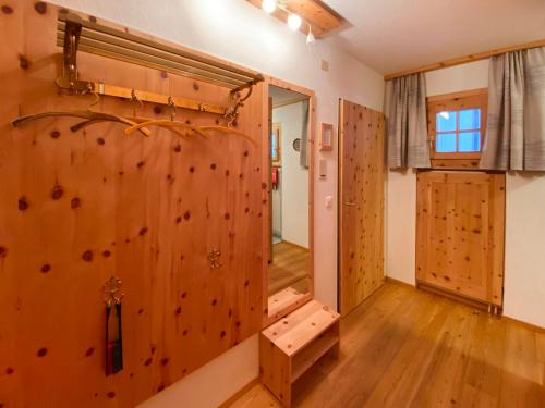a room with a rock climbing wall in a house at Apartment Chesa Alvetern 5 by Interhome in Sils Maria