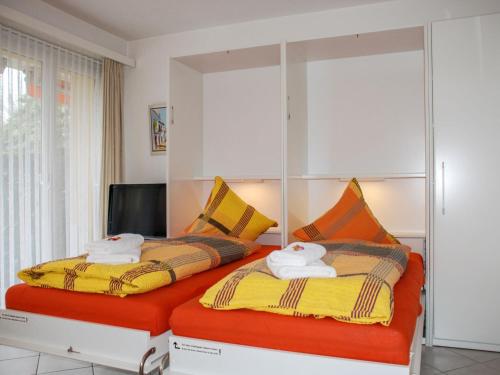Ένα ή περισσότερα κρεβάτια σε δωμάτιο στο Apartment Residenza Lido Appartment 9 by Interhome