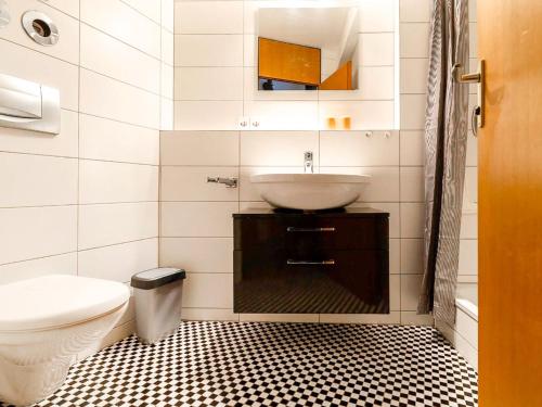 a bathroom with a sink and a toilet at Apartment Ferienwohnpark Immenstaad-3 by Interhome in Immenstaad am Bodensee