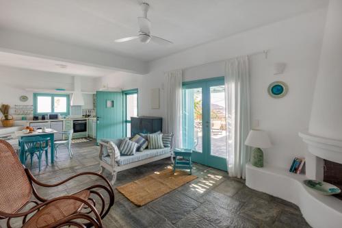 a living room with a couch and a table at Magganari View Village in Manganari