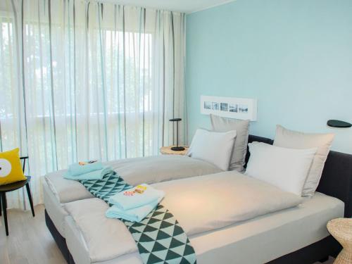 Ένα ή περισσότερα κρεβάτια σε δωμάτιο στο Apartment LaVille A-3-4 by Interhome