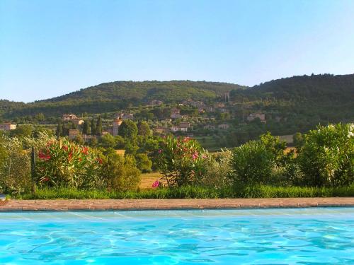 a swimming pool with a view of a mountain at Apartment L'Erika by Interhome in Cetinale