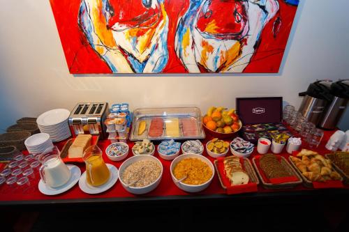 a table topped with lots of food on a table at Hotel Bla Bla in Bruges