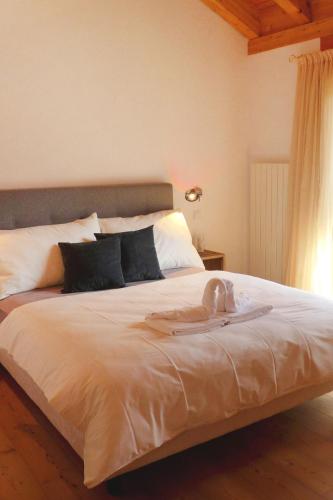 a bedroom with a bed with a turkey on it at Apartment Chesa Vadret 12 by Interhome in Pontresina