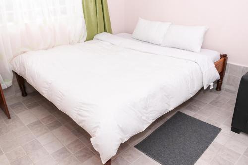 Cama o camas de una habitación en Olive Green Garden Resort