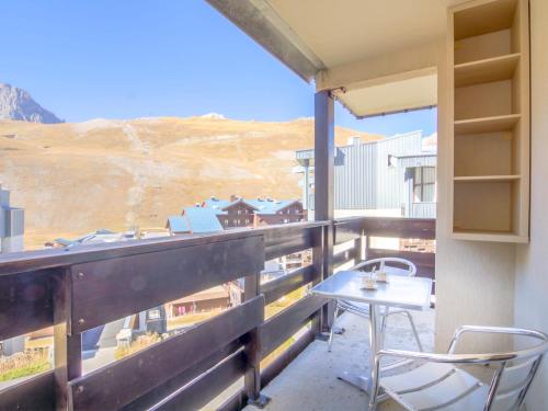 a table and chairs on a balcony with a view at Studio Plein Soleil - Val Claret-9 by Interhome in Tignes