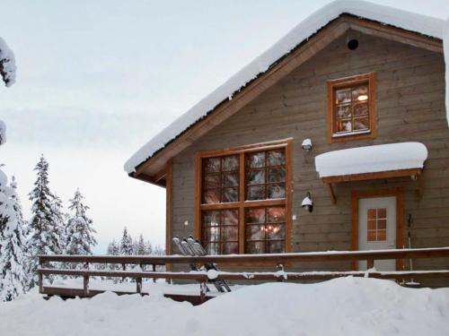 a log cabin in the snow with snow at Holiday Home Kivalonmaa a by Interhome in Äkäslompolo