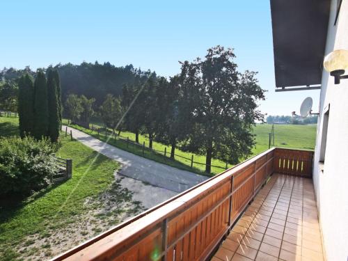 a balcony of a house with a view of a field at Holiday Home Berg by Interhome in Obermieger
