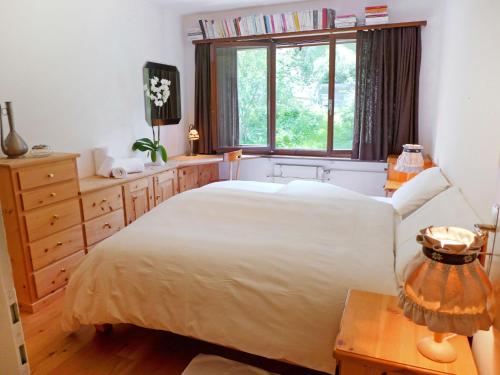 Postel nebo postele na pokoji v ubytování Apartment Chesa Arlas D2 by Interhome