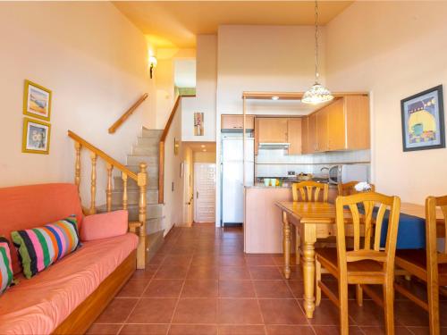 a living room and kitchen with a couch and a table at Holiday Home Salvagina 53 by Interhome in Riumar