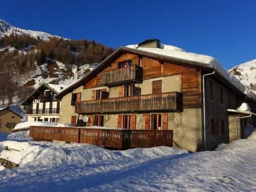 a large wooden building with snow on the ground at Apartment Chalet Le Tour by Interhome in Chamonix-Mont-Blanc