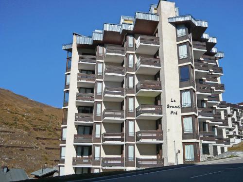 a tall building with balconies on the side of it at Studio Le Grand Pré-5 by Interhome in Tignes