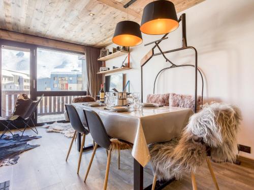 a dining room with a table and chairs at Apartment Super Tignes-1 by Interhome in Tignes