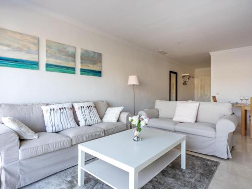 a living room with a couch and a table at Apartment Mirador by Interhome in San Pedro de Alcantara