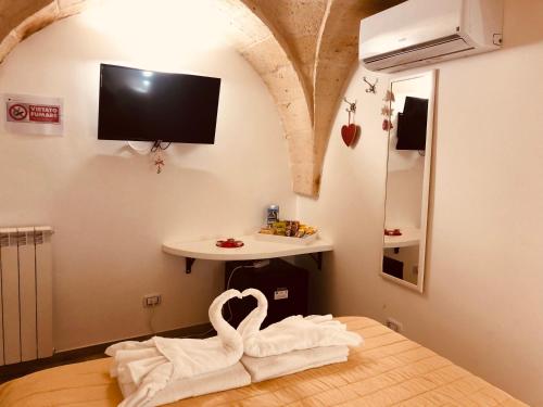 Televízia a/alebo spoločenská miestnosť v ubytovaní Mastropaolo42 Luxury B&B