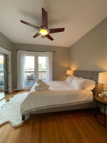 a bedroom with a bed with a ceiling fan at Amazing 3BR 3 BA Property in Chicago in Chicago