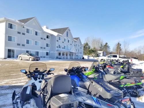 a row of motorcycles parked in front of a building at Ramada by Wyndham Miramichi New Brunswick in Miramichi