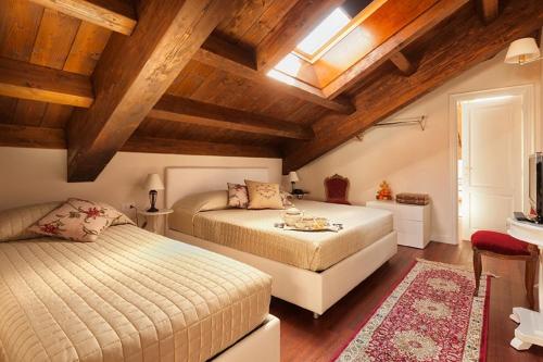 Ένα ή περισσότερα κρεβάτια σε δωμάτιο στο Principessa di Savoia
