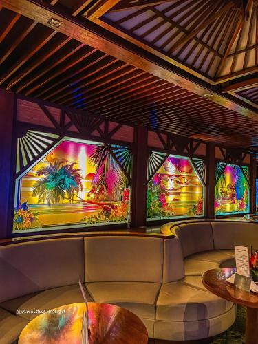 a room with a couch and stained glass windows at Hotel Tiama Abidjan in Abidjan