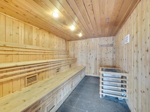 a sauna with wood paneling and a wooden ceiling at 101 Edgewater Inn in Charlevoix
