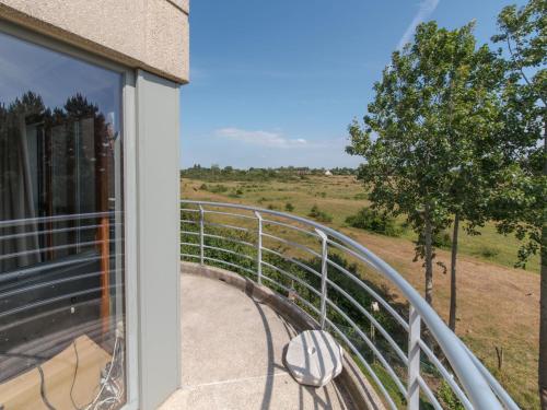 a balcony with a view of the countryside from a house at Apartment Residentie Cannes 208 by Interhome in Bredene