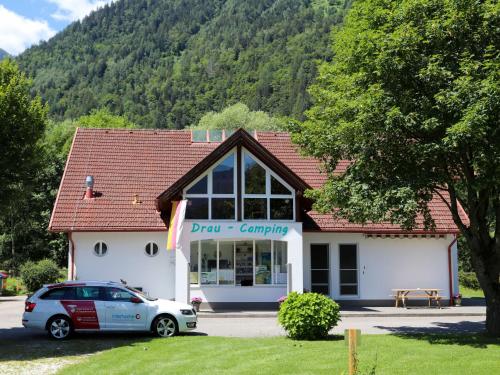 a car parked in front of a building at Holiday Home Draucamping by Interhome in Sachsenburg