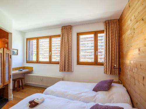 Katil atau katil-katil dalam bilik di Apartment Le Shamrock - Le Lac-5 by Interhome