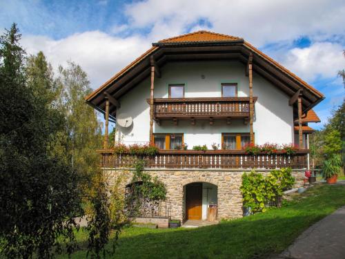 a house with a balcony on top of it at Holiday Home Kralovice by Interhome in Nebahovy