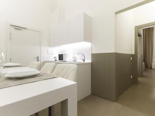 A kitchen or kitchenette at Apartment Tipologia Trilo 05 pax by Interhome