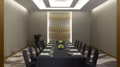 a conference room with a long table with black chairs at Grand InterContinental Seoul Parnas by IHG in Seoul