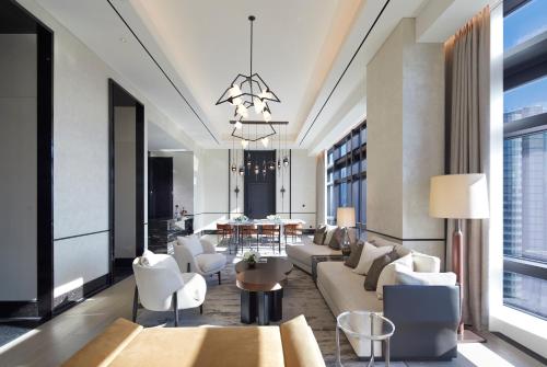 a lobby with couches and chairs and a table at Grand InterContinental Seoul Parnas by IHG in Seoul