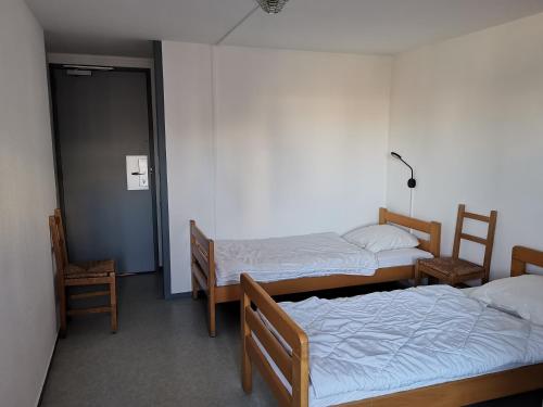 Ένα ή περισσότερα κρεβάτια σε δωμάτιο στο Auberge de Jeunesse HI Boulogne-sur-Mer