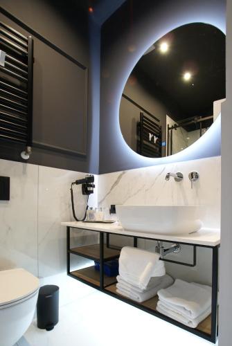 a bathroom with a sink and a mirror at Fingerprint Luxury Apartments in Zagreb