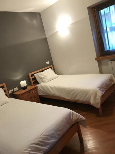 Postel nebo postele na pokoji v ubytování Villa Dosso del Grillo