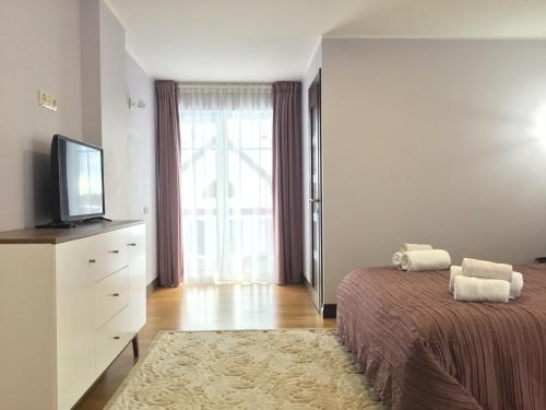 Una cama o camas en una habitación de Radvi House