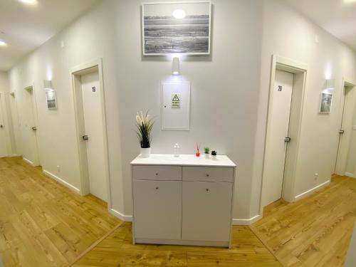 a bathroom with a white sink in a room at Sol Rio De Alverca in Quinta da Verdelha