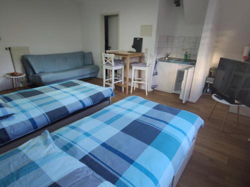 a living room with two beds and a couch at FeWo Alb-Traum in Albstadt