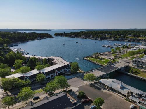 an aerial view of a marina with boats in the water at 232 Edgewater Inn in Charlevoix