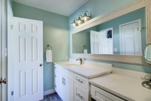 a bathroom with a sink and a mirror at 2 B, Three Bedroom Townhome in Destin