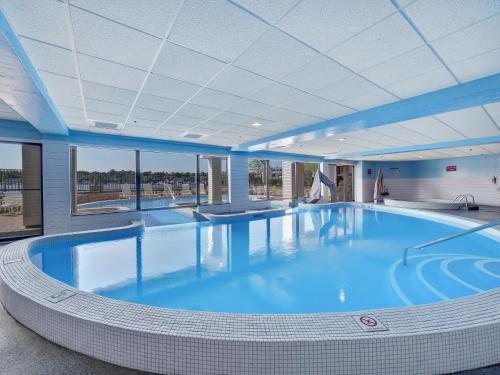 a large swimming pool in a building at 357 Edgewater Inn in Charlevoix