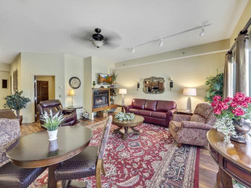 a living room with a couch and a table at 377 Edgewater Inn in Charlevoix